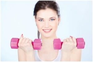 woman doing exercise with dumbbells