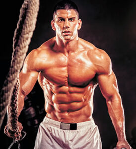 bodybuilder doing muscle rope exercise