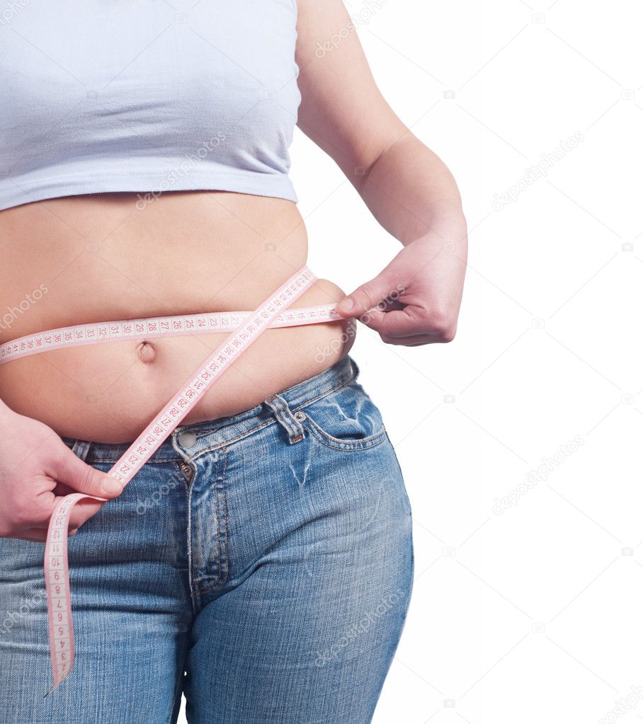 Fat woman measuring her belly fat with tape